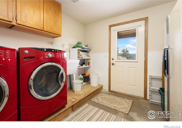 366 N Rim Rd, Livermore, CO 80536 - laundry area with washing machine and dryer and cabinet space