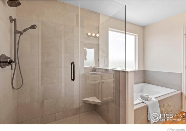 7266 Andover St, Wellington, CO 80549 - full bathroom featuring a shower stall and a garden tub