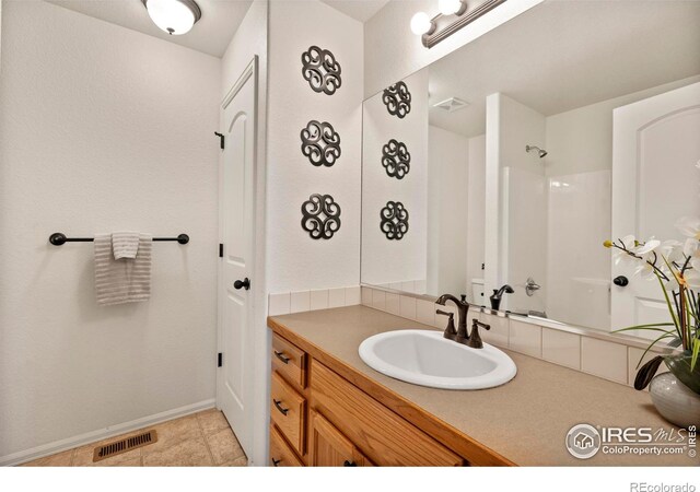 7266 Andover St, Wellington, CO 80549 - full bathroom with vanity and a shower