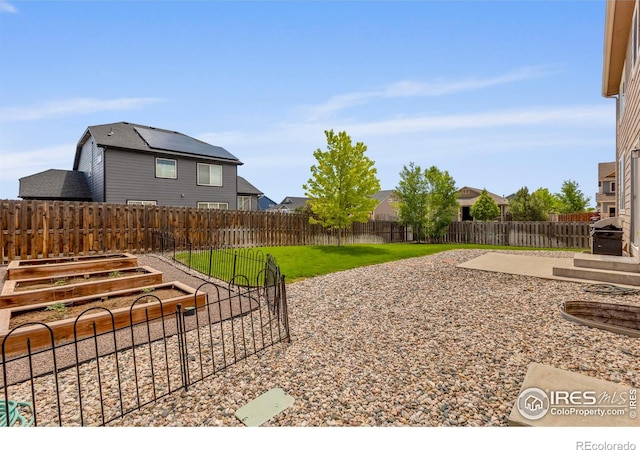 7266 Andover St, Wellington, CO 80549 - fenced backyard with a garden and a patio