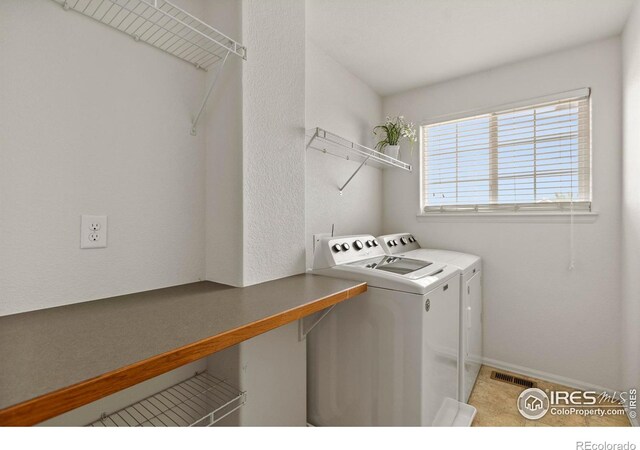 7266 Andover St, Wellington, CO 80549 - laundry room featuring independent washer and dryer and baseboards