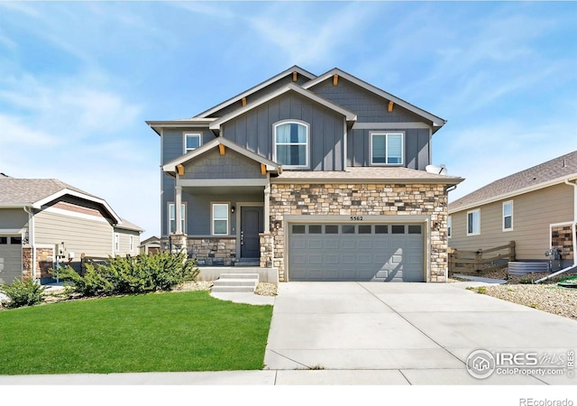 5562 Bristow Rd, Timnath, CO 80547 - craftsman inspired home featuring board and batten siding, an attached garage, driveway, a front lawn, and stone siding