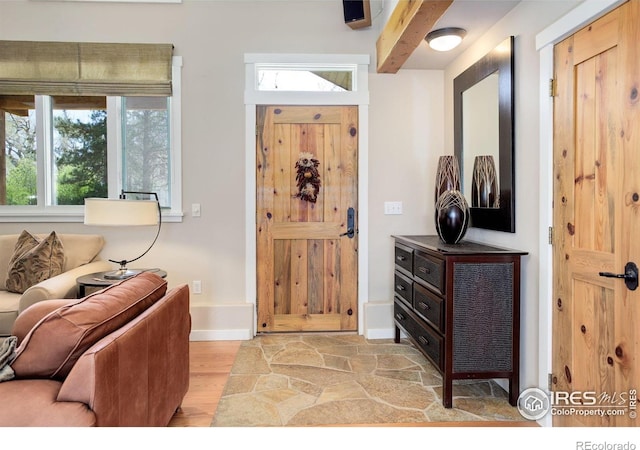 9445 Lykins Pl, Boulder, CO 80301 - foyer with healthy amount of natural light and light wood-style floors