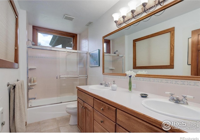 9445 Lykins Pl, Boulder, CO 80301 - bathroom with combined bath / shower with glass door, double vanity, and tile patterned flooring