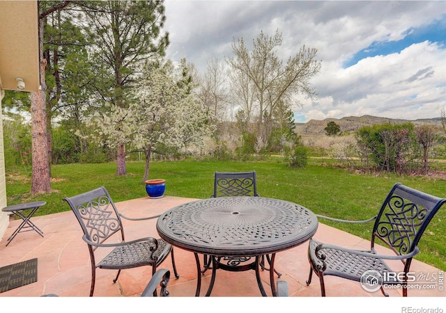 9445 Lykins Pl, Boulder, CO 80301 - view of patio featuring a mountain view and outdoor dining space