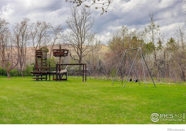 9445 Lykins Pl, Boulder, CO 80301 - view of green lawn with a playground