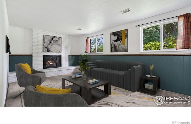 2013 Ridgewood Rd, Fort Collins, CO 80526 - carpeted living room with a fireplace and a textured ceiling