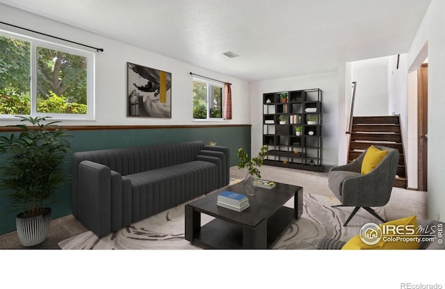 2013 Ridgewood Rd, Fort Collins, CO 80526 - living area featuring carpet flooring, stairs, and a textured ceiling