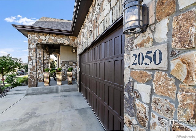 2050 Vineyard Dr, Windsor, CO 80550 - view of exterior entry featuring stone siding