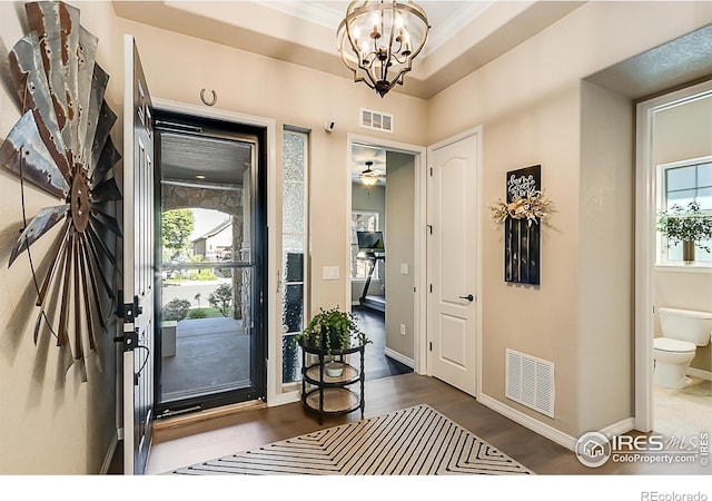 2050 Vineyard Dr, Windsor, CO 80550 - foyer with a chandelier and wood finished floors