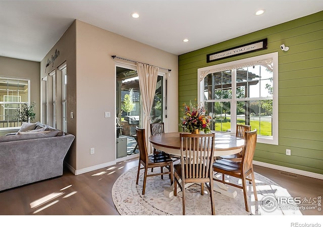 2050 Vineyard Dr, Windsor, CO 80550 - dining room featuring wood finished floors, recessed lighting, and wooden walls