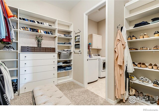 2050 Vineyard Dr, Windsor, CO 80550 - walk in closet with light carpet and washer and dryer