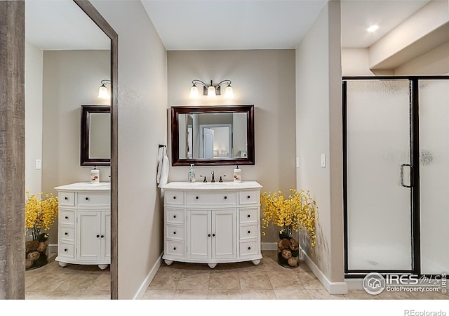 2050 Vineyard Dr, Windsor, CO 80550 - bathroom with a stall shower, two vanities, and tile patterned floors
