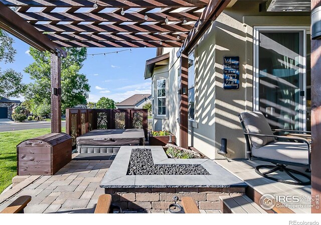 2050 Vineyard Dr, Windsor, CO 80550 - view of patio with an outdoor fire pit and a pergola