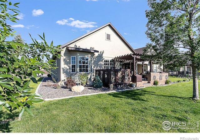 2050 Vineyard Dr, Windsor, CO 80550 - back of property with a pergola, stucco siding, and a yard