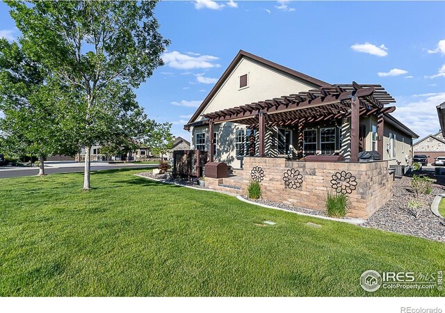 2050 Vineyard Dr, Windsor, CO 80550 - view of property exterior featuring a pergola, a lawn, and stucco siding