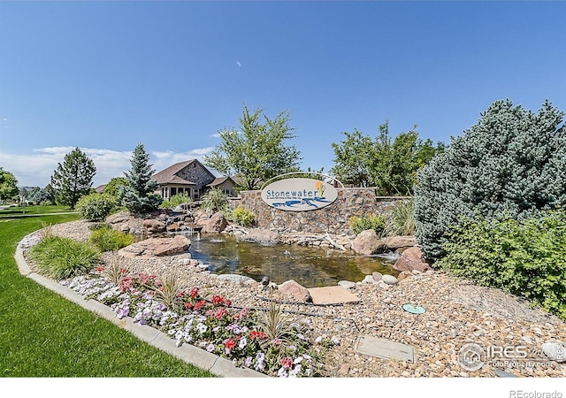 2050 Vineyard Dr, Windsor, CO 80550 - community sign with a garden pond