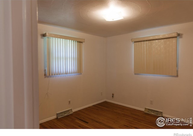 3211 Butternut Dr, Loveland, CO 80538 - unfurnished room with wood finished floors and baseboards