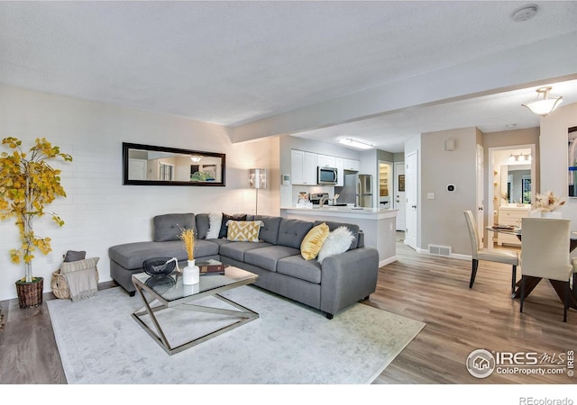 4763 White Rock Cir Unit A, Boulder, CO 80301 - living area featuring wood finished floors and baseboards