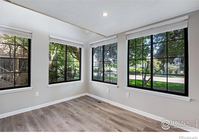 4763 White Rock Cir Unit A, Boulder, CO 80301 - unfurnished room with healthy amount of natural light, wood finished floors, and recessed lighting