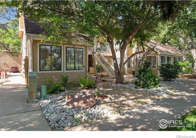 4763 White Rock Cir Unit A, Boulder, CO 80301 - view of front of house with stairway and a shingled roof