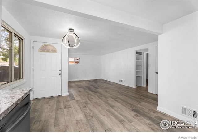 1111 Wabash St, Denver, CO 80220 - unfurnished living room with wood finished floors and baseboards