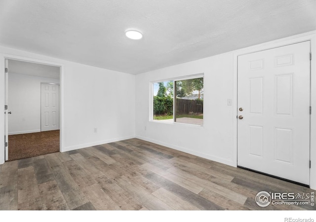 1111 Wabash St, Denver, CO 80220 - entryway with wood finished floors and baseboards