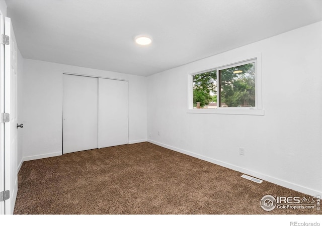 1111 Wabash St, Denver, CO 80220 - unfurnished bedroom featuring carpet floors and a closet