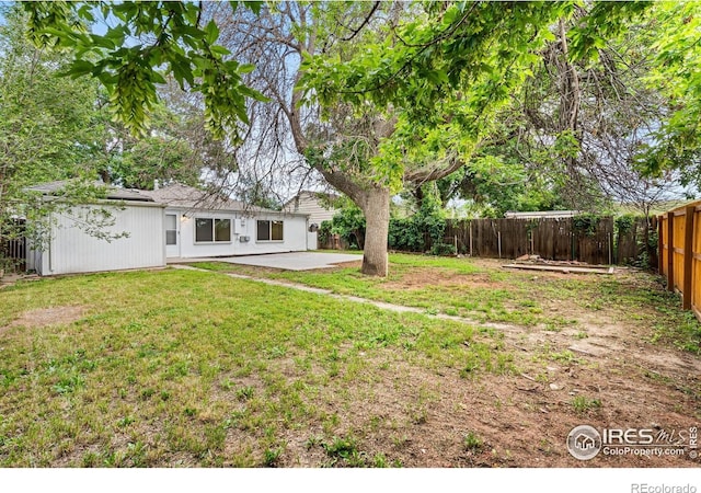 1111 Wabash St, Denver, CO 80220 - fenced backyard featuring a patio area