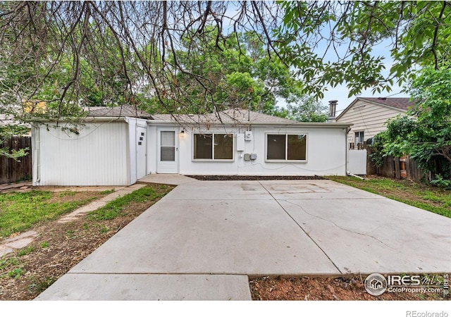 1111 Wabash St, Denver, CO 80220 - rear view of property featuring a patio