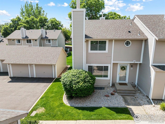 4255 Westshore Way Unit 19, Fort Collins, CO 80525 - view of property featuring a chimney, a residential view, and a garage