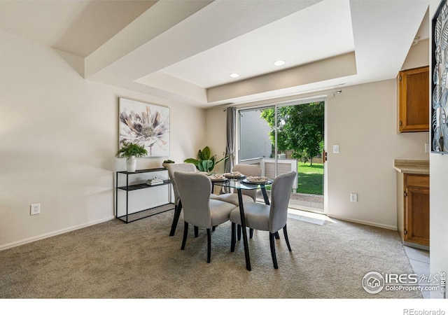 4255 Westshore Way Unit 19, Fort Collins, CO 80525 - dining room with a tray ceiling, light carpet, and recessed lighting