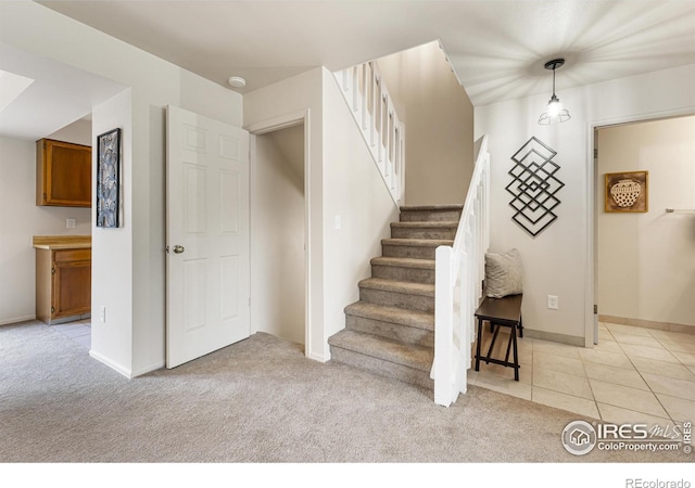 4255 Westshore Way Unit 19, Fort Collins, CO 80525 - stairs with carpet and tile patterned floors