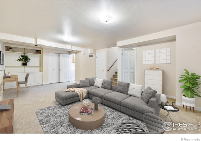 4255 Westshore Way Unit 19, Fort Collins, CO 80525 - living room with carpet, stairs, and a textured ceiling