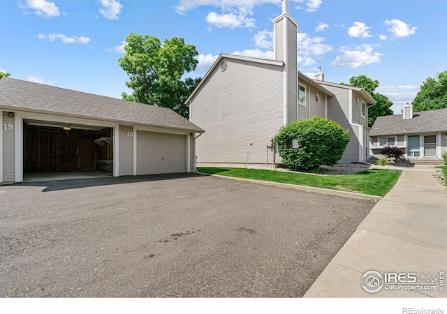 4255 Westshore Way Unit 19, Fort Collins, CO 80525 - view of side of home with an outbuilding and a chimney