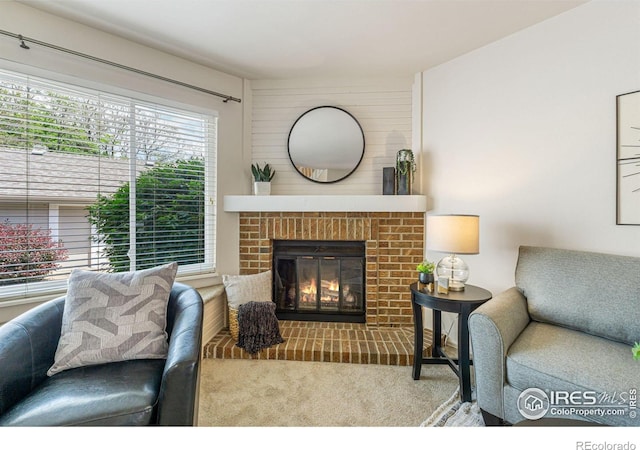 4255 Westshore Way Unit 19, Fort Collins, CO 80525 - carpeted living area featuring a brick fireplace
