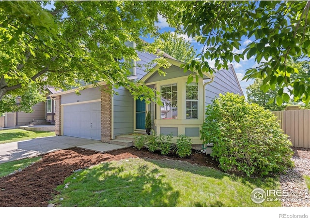1667 Reliance Cir, Superior, CO 80027 - view of front of home featuring brick siding, concrete driveway, and a garage