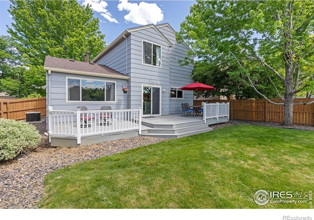 1667 Reliance Cir, Superior, CO 80027 - rear view of house with a fenced backyard, a wooden deck, and a shingled roof