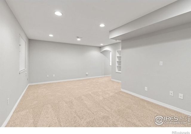 1667 Reliance Cir, Superior, CO 80027 - finished basement with carpet flooring, recessed lighting, and arched walkways