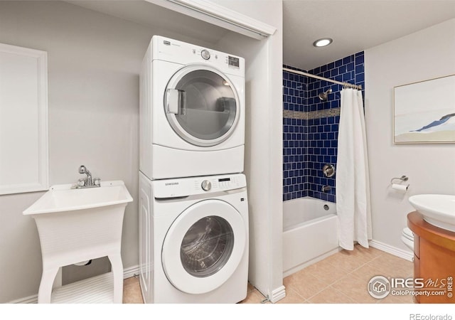 1667 Reliance Cir, Superior, CO 80027 - laundry room with estacked washer and dryer and light tile patterned flooring