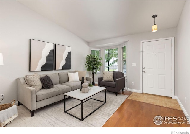 1667 Reliance Cir, Superior, CO 80027 - living room featuring light wood-type flooring and lofted ceiling