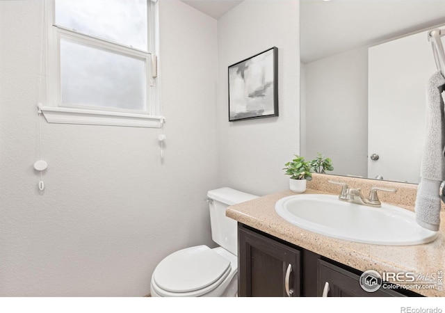 1667 Reliance Cir, Superior, CO 80027 - half bathroom featuring toilet and vanity