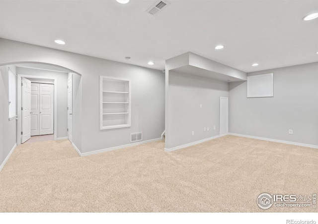 1667 Reliance Cir, Superior, CO 80027 - basement with carpet flooring, recessed lighting, built in features, and arched walkways