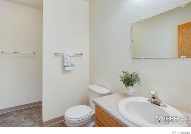 8943 Gander Valley Ln, Windsor, CO 80550 - half bathroom featuring vanity and baseboards