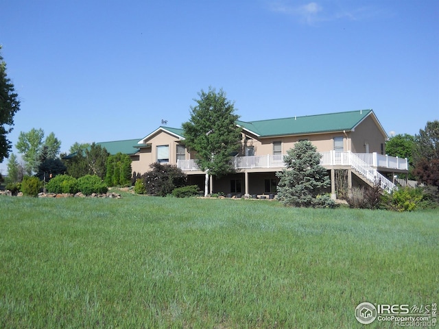 8943 Gander Valley Ln, Windsor, CO 80550 - view of yard featuring a wooden deck and stairway