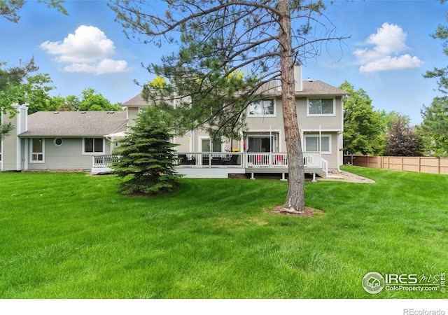 4255 Westshore Way Unit B4, Fort Collins, CO 80525 - back of property with a deck and a chimney
