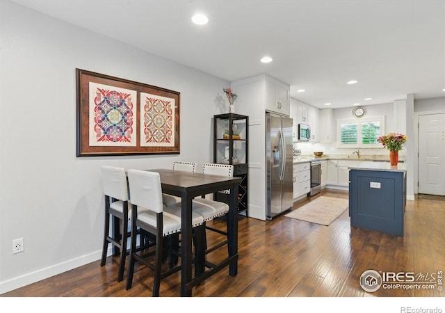 4255 Westshore Way Unit B4, Fort Collins, CO 80525 - dining room featuring dark wood-type flooring and recessed lighting