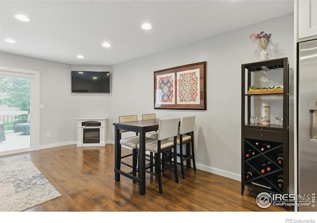 4255 Westshore Way Unit B4, Fort Collins, CO 80525 - dining area featuring dark wood-style floors, recessed lighting, and a glass covered fireplace