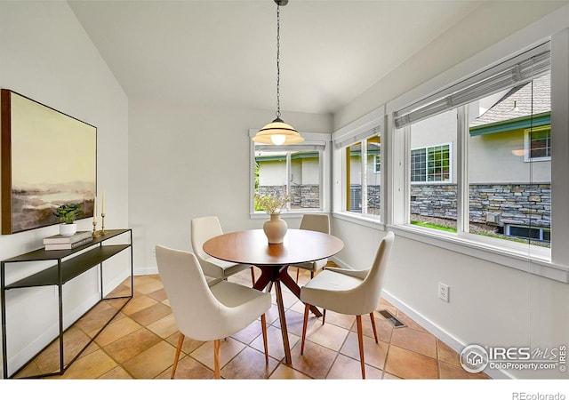 2226 Eagles Nest Dr, Lafayette, CO 80026 - tiled dining space featuring baseboards