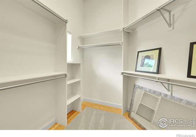 2226 Eagles Nest Dr, Lafayette, CO 80026 - walk in closet with wood finished floors